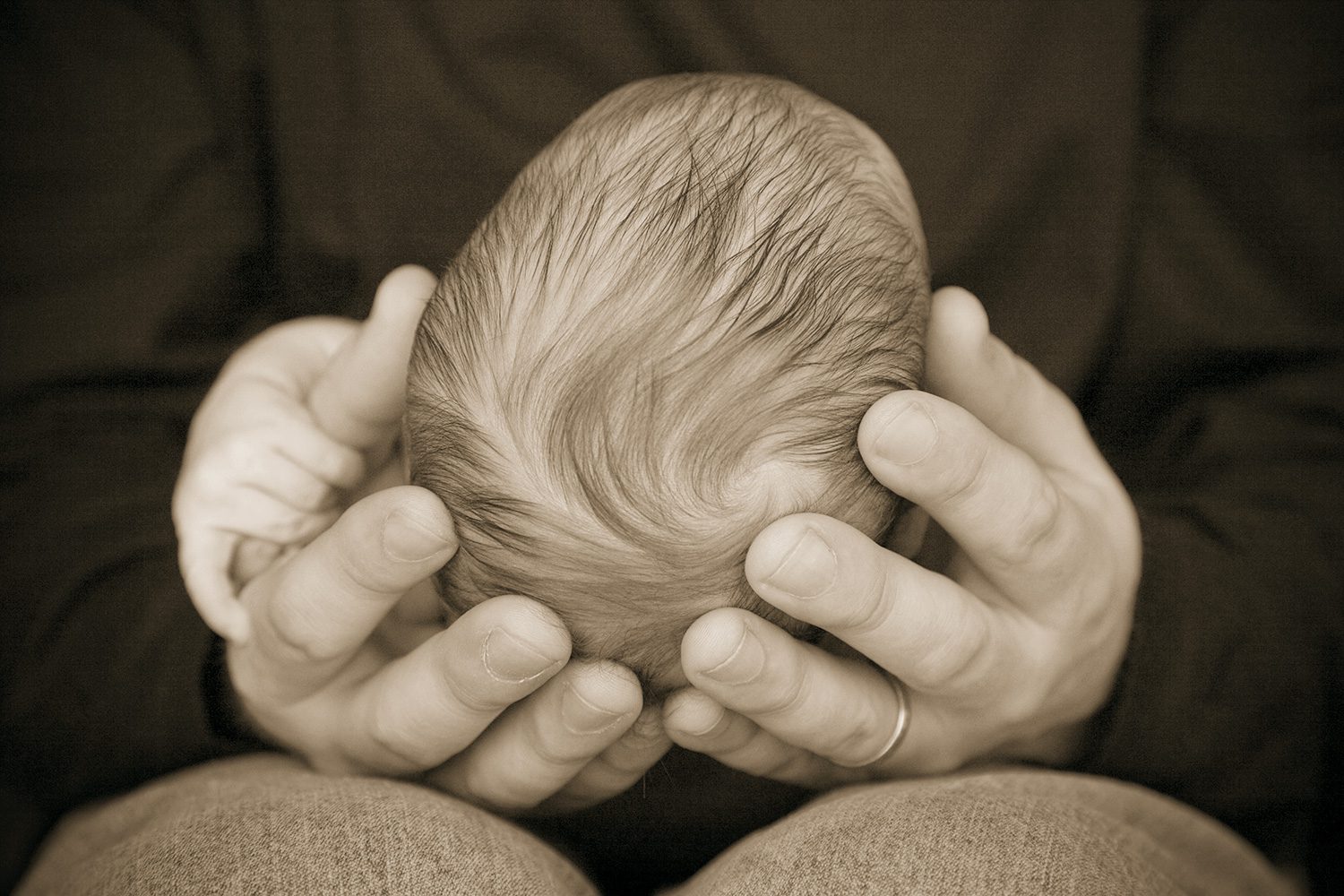 Portrait of Father Holding Newborn Baby Boy, Photography Studio in Flagstaff
