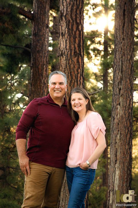 Couples Portrait in Flagstaff, AZ, Sunlight shines thought the ponderosa on a summer afternoon in Flagstaff