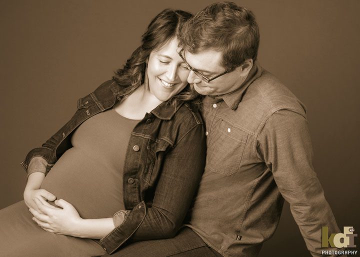 Studio portrait of pregnant couple In black and white, maternity portraits in Flagstaff, AZ