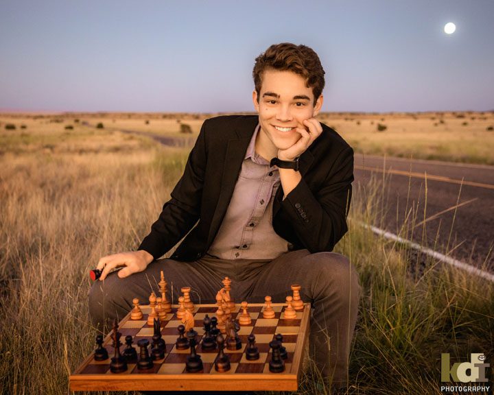Senior portrait, playing chess by the side of the road, north of Flagstaff, AZ