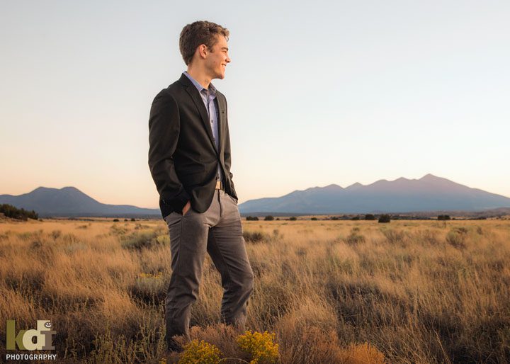 Senior portrait in the desert with the San Francisco Peaks in the background, north of Flagstaff, AZ