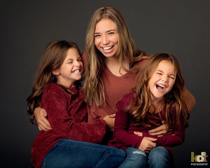 Three girls laughing in family photos, Flagstaff