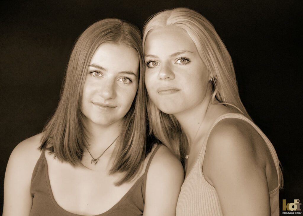 Black and white studio portrait of sisters, in Flagstaff photography studio.