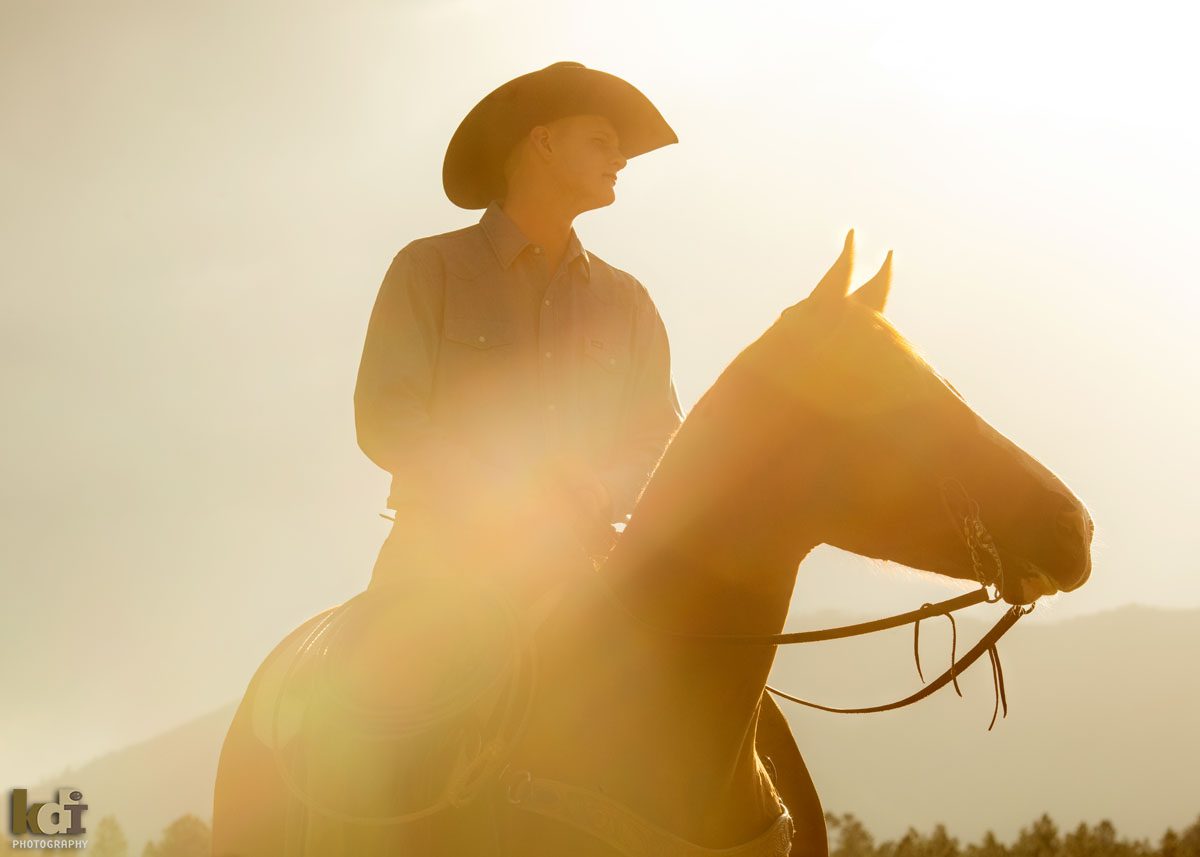 Senior Photo of cowboy on horseback as the sun sets in the mountains of Flagstaff, AZ, KDI Photography