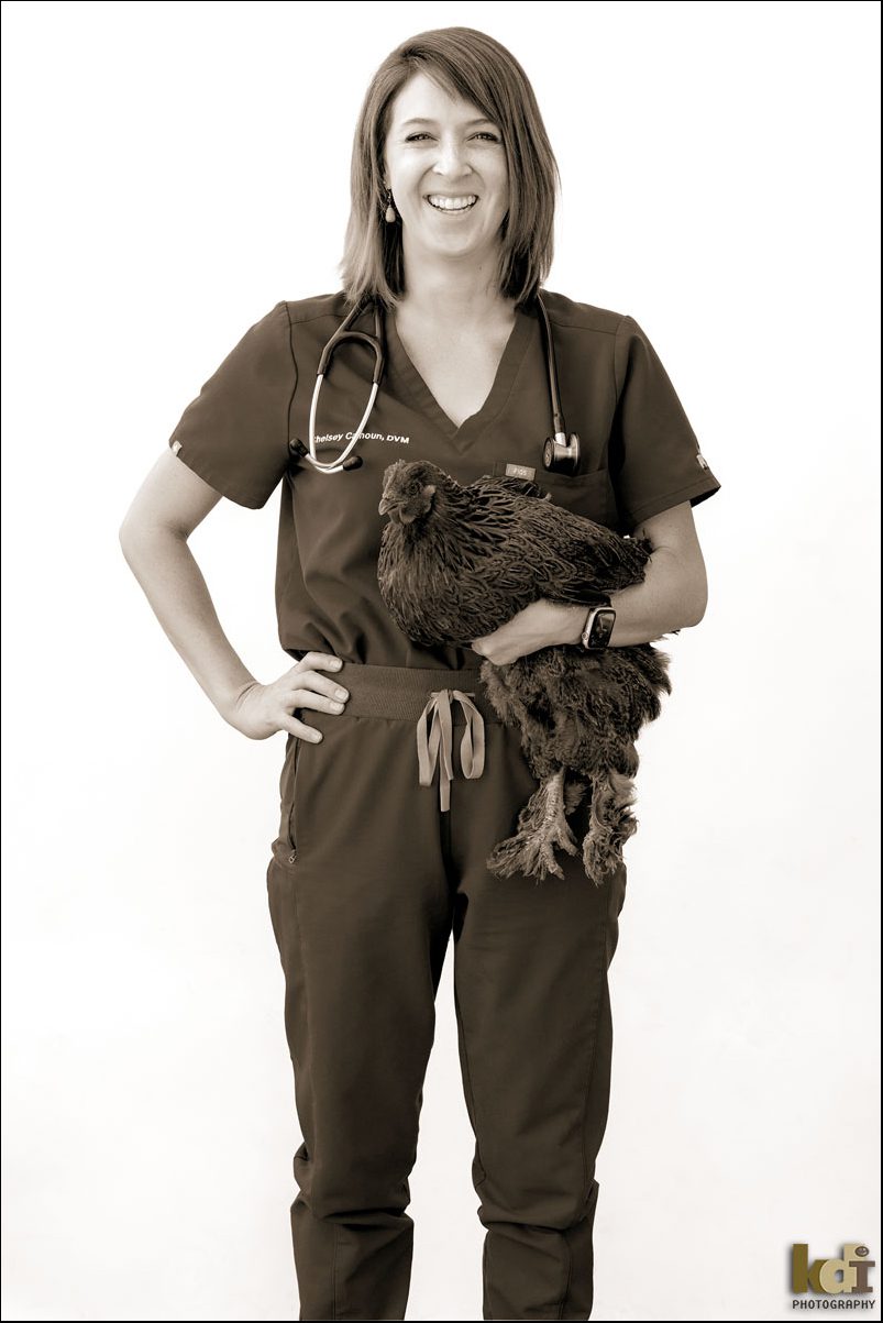 Black and White Portrait of Veterinarian Holding Chicken, Laughing in Flagstaff AZ, by KDI Photography