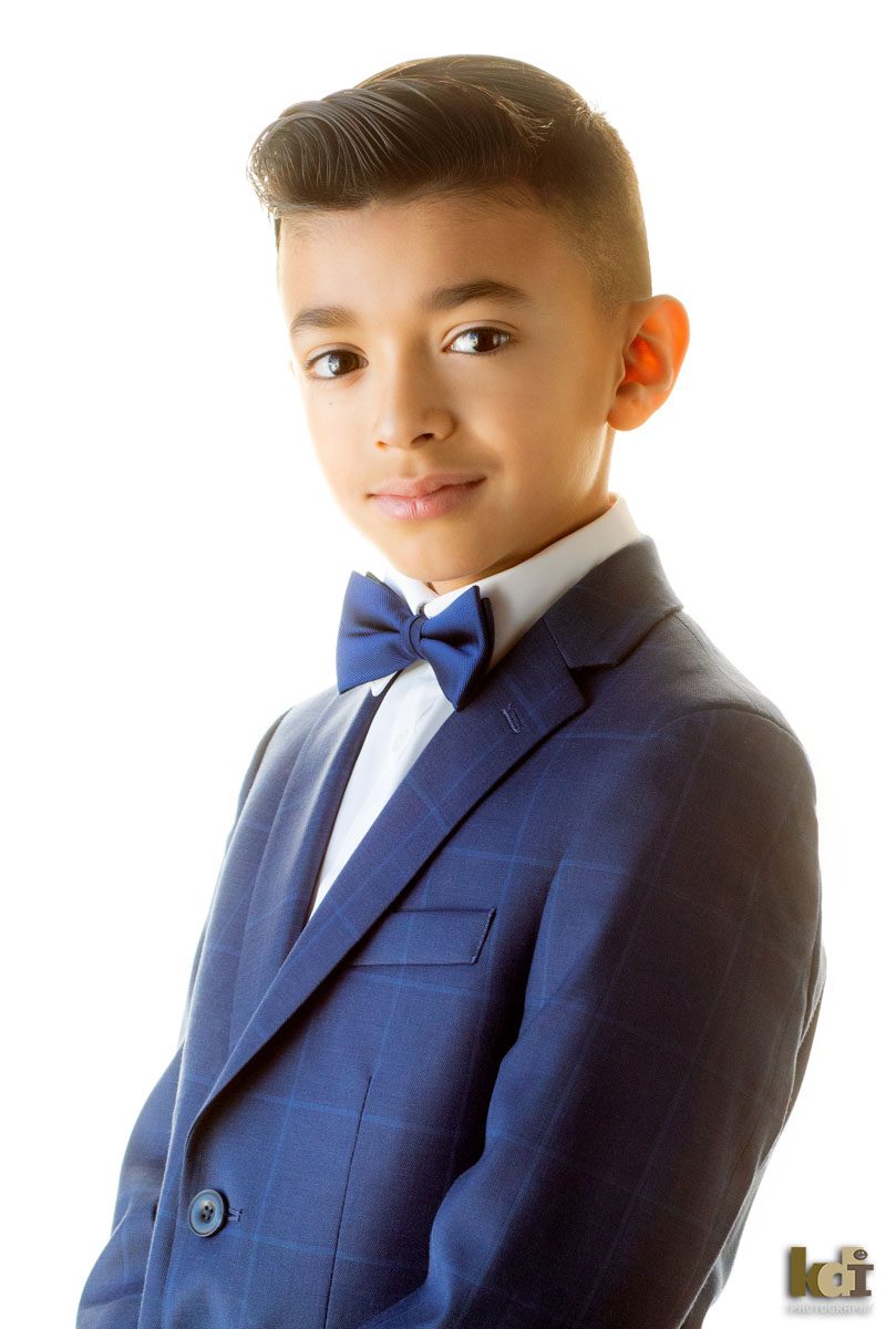 Studio Portrait of Boy in First Communion Attire, With Suit Jacket and Bow-tie, Kids and Family Photos in Flagstaff, AZ © KDI Photography