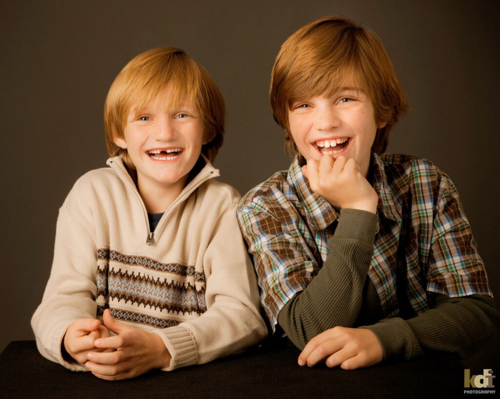 Portrait of a tween preteen brothers laughing, studio family pictures in Northern Arizona, family photographs by KDI Photography