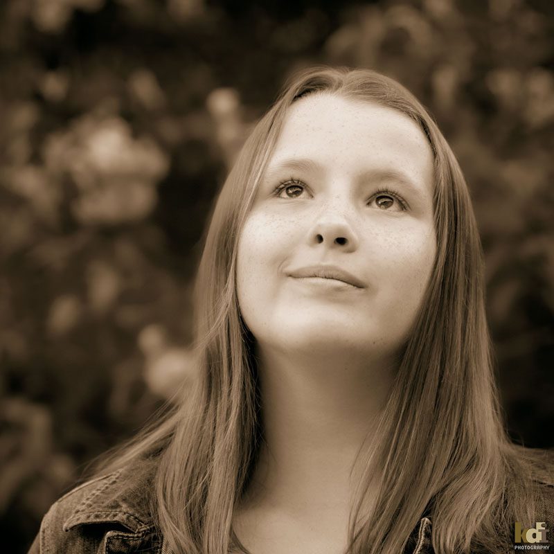 Color portrait of preteen girl looking upwards, in Sedona AZ, photographic art by KDI Photography