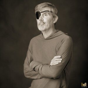 Photographer John Burcham in black and white studio portrait, March 2026, by Flagstaff portrait photographer, KDI Photography