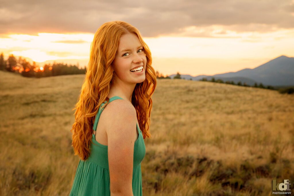 High school senior photos showing girl with red hair, during the sunset, Northern Arizona, portrait photography in Flagstaff AZ by senior photographer KDI Photography